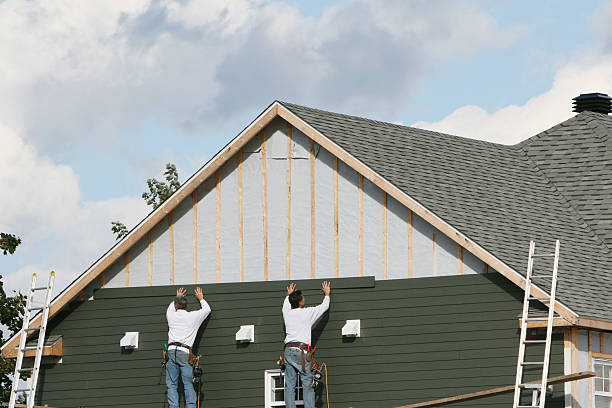 Professional Storm Damage Siding Repair technician working in Wake, VA